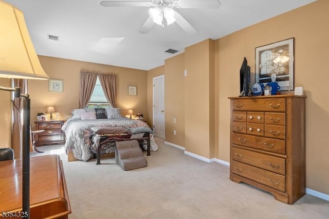 bedroom with a ceiling fan, light colored carpet, and visible vents