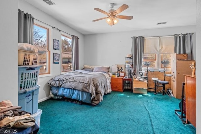 carpeted bedroom featuring a ceiling fan and visible vents