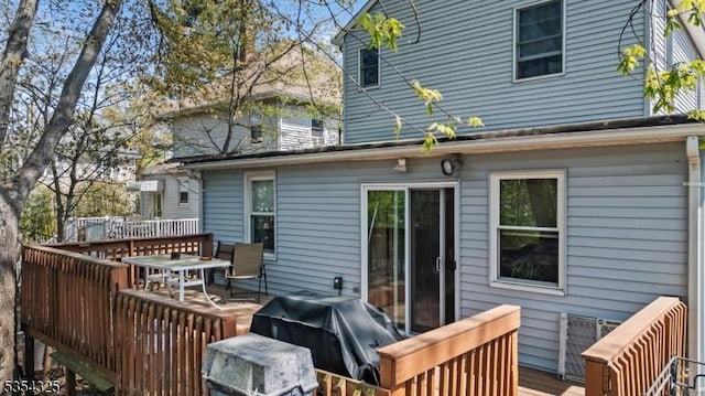 wooden deck with grilling area
