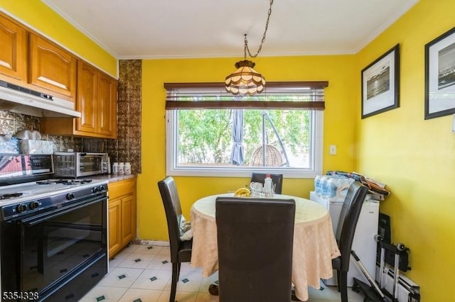 dining space with ornamental molding, baseboard heating, and a toaster