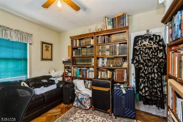 sitting room featuring ceiling fan