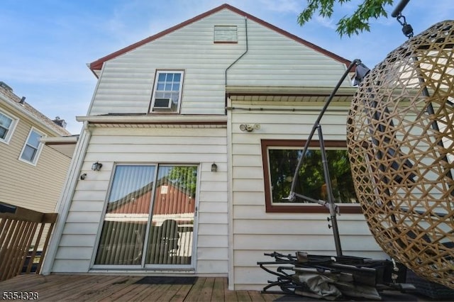 rear view of property with a deck