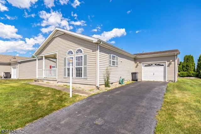 5 Bridgewater Ave, Stafford Twp, NJ 08050 - view of front facade with asphalt driveway, a garage, a front yard, and a porch