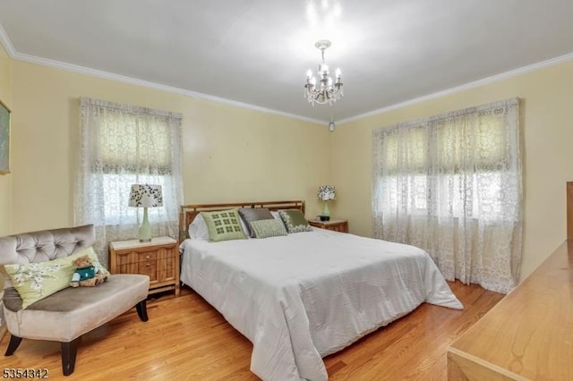bedroom with crown molding, multiple windows, and a notable chandelier