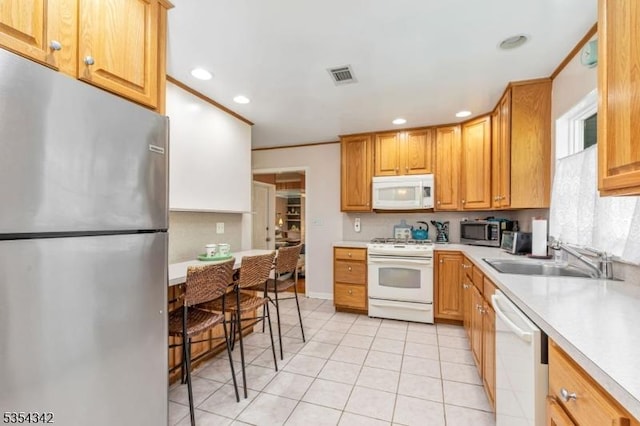 kitchen with visible vents, light tile patterned flooring, recessed lighting, a sink, and appliances with stainless steel finishes