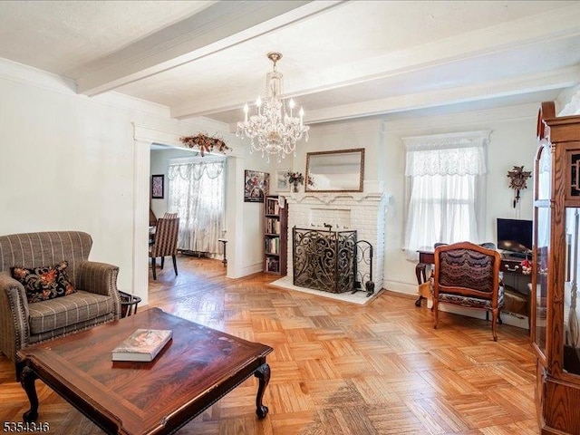 living room featuring baseboards, an inviting chandelier, beam ceiling, and a fireplace