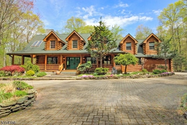31 Kent Rd, Hampton Twp, NJ 07860 - cabin featuring curved driveway, log exterior, and a porch