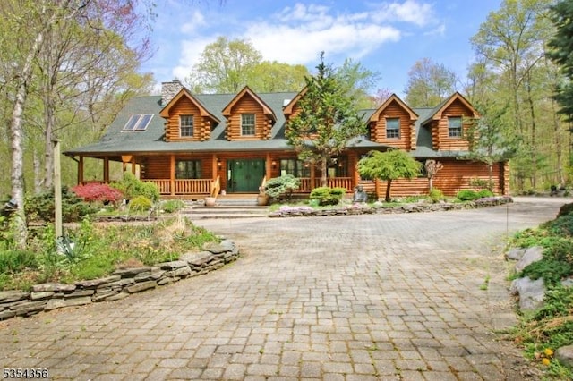 31 Kent Rd, Hampton Twp, NJ 07860 - log home with a porch, decorative driveway, a chimney, and log exterior