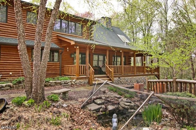 31 Kent Rd, Hampton Twp, NJ 07860 - back of house featuring a porch, a shingled roof, a chimney, and log siding