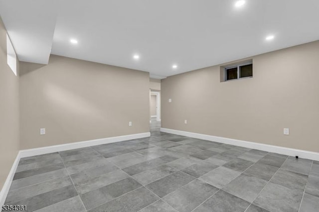 finished basement with recessed lighting and baseboards
