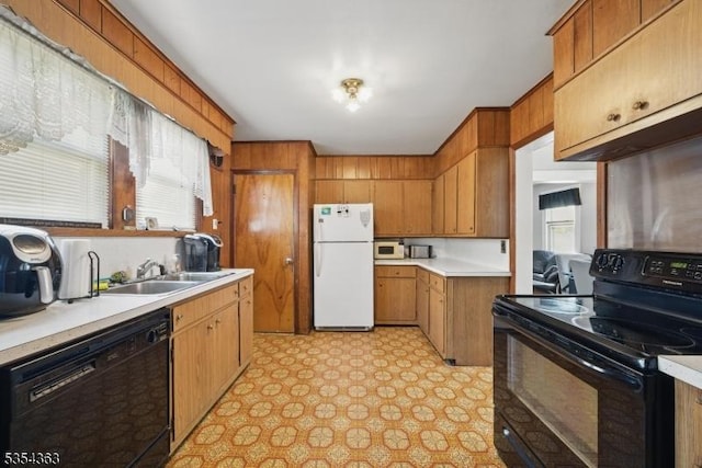 149 Roessler St, Boonton Town, NJ 07005 - kitchen featuring black appliances, a sink, light countertops, brown cabinets, and light floors