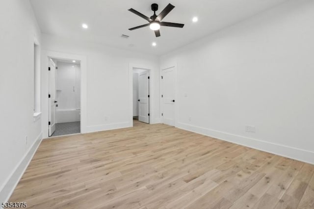 unfurnished bedroom with connected bathroom, recessed lighting, baseboards, and light wood-style flooring