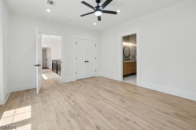 unfurnished bedroom featuring visible vents, baseboards, ensuite bathroom, recessed lighting, and light wood finished floors