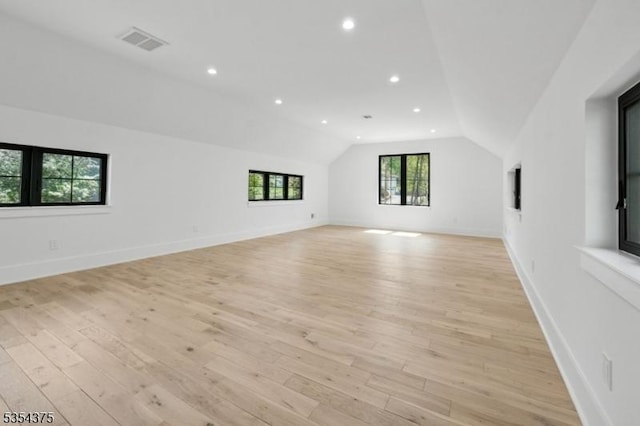 bonus room featuring visible vents, lofted ceiling, baseboards, recessed lighting, and light wood-type flooring