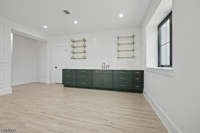 bar with recessed lighting, baseboards, visible vents, and light wood-style floors