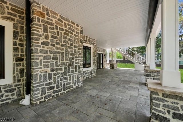 view of patio / terrace featuring stairs
