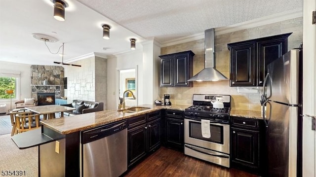 3 Wild Turkey Way Unit 240/, Hardyston Twp, NJ 07419 - kitchen featuring stainless steel appliances, wall chimney range hood, a sink, dark wood finished floors, and a peninsula