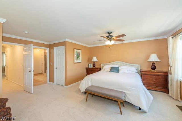 bedroom with crown molding, baseboards, a ceiling fan, and light colored carpet