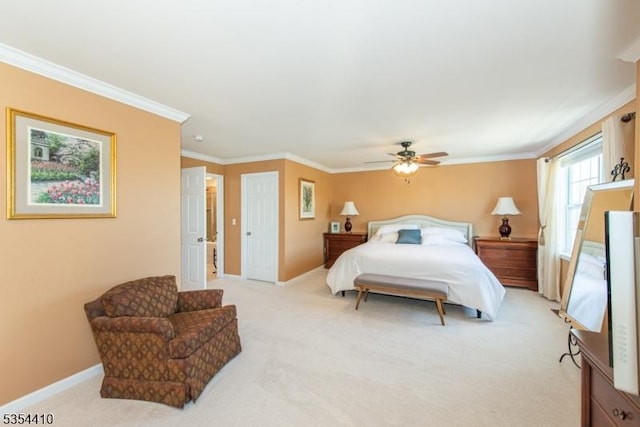 bedroom featuring baseboards, ornamental molding, a ceiling fan, and light colored carpet