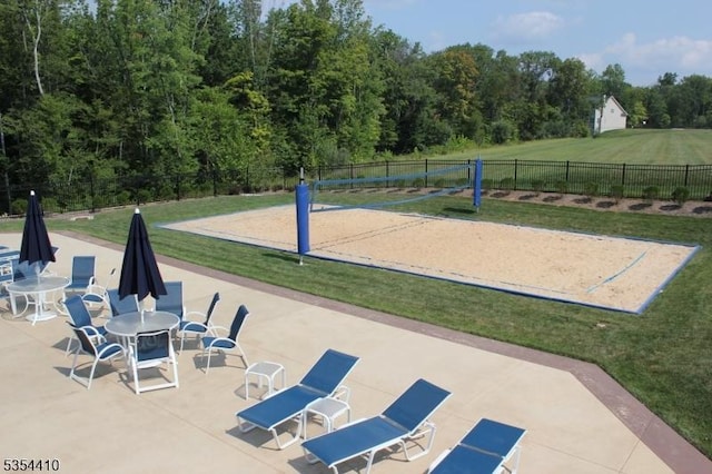 view of home's community with a yard, a patio, fence, and volleyball court