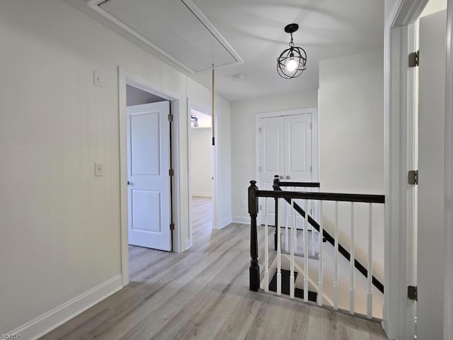 521 Parkwood Ct, Phillipsburg Town, NJ 08865 - hall featuring attic access, an upstairs landing, wood finished floors, and baseboards