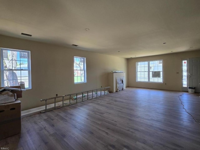 521 Parkwood Ct, Phillipsburg Town, NJ 08865 - unfurnished living room with wood finished floors, healthy amount of natural light, and baseboards