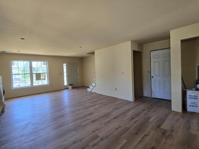 521 Parkwood Ct, Phillipsburg Town, NJ 08865 - unfurnished living room featuring wood finished floors and stairs