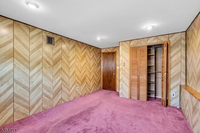 42 E Lincoln Ave, Roselle Park Boro, NJ 07204 - unfurnished bedroom featuring wood walls, carpet, and a closet