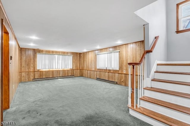 42 E Lincoln Ave, Roselle Park Boro, NJ 07204 - unfurnished living room featuring a baseboard heating unit, a baseboard radiator, carpet flooring, wooden walls, and stairway
