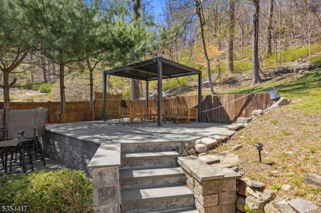 view of yard featuring a fenced backyard, a patio area, and a deck