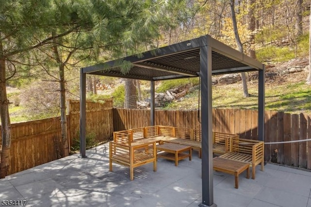 view of patio / terrace with a pergola, an outdoor living space, and a fenced backyard