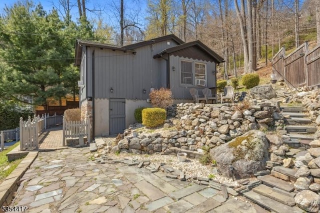 view of home's exterior with fence