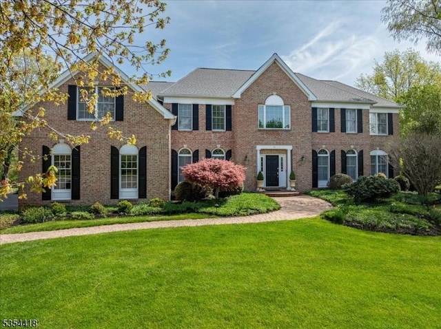 17 Hunters Path, Montgomery Twp, NJ 08558 - view of front of house featuring a front lawn and brick siding