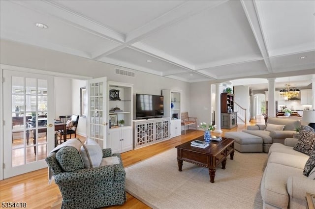 17 Hunters Path, Montgomery Twp, NJ 08558 - living room featuring decorative columns, light wood-style flooring, visible vents, and coffered ceiling