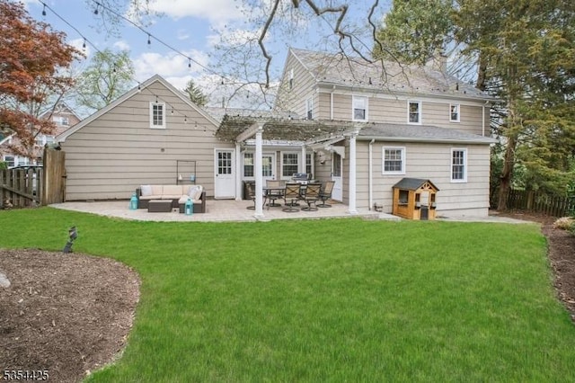 rear view of house with a yard, a pergola, fence, and outdoor lounge area
