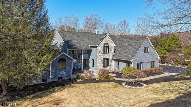 25 Hook Mountain Dr, Clinton Twp, NJ 08801 - view of front of house featuring covered porch, a shingled roof, stone siding, and a front lawn