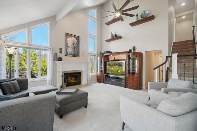 25 Hook Mountain Dr, Clinton Twp, NJ 08801 - living area with a ceiling fan, a fireplace with flush hearth, high vaulted ceiling, carpet, and stairs