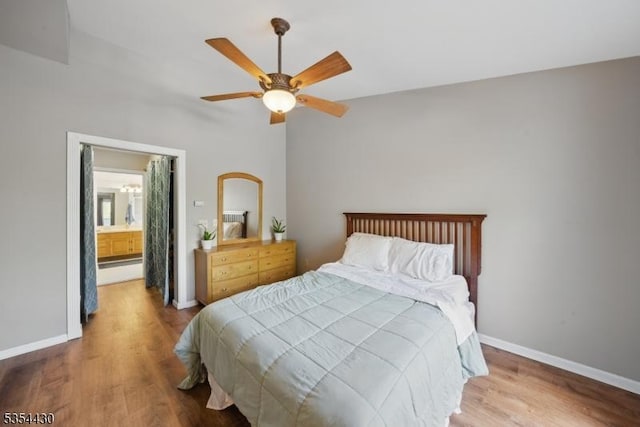 bedroom featuring baseboards, a ceiling fan, and wood finished floors