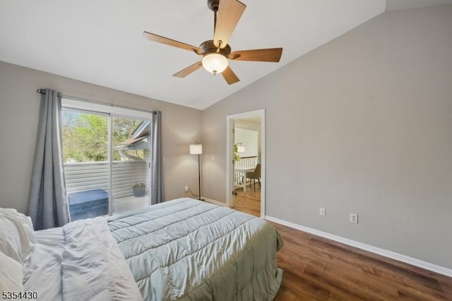 bedroom featuring baseboards, ceiling fan, wood finished floors, and vaulted ceiling