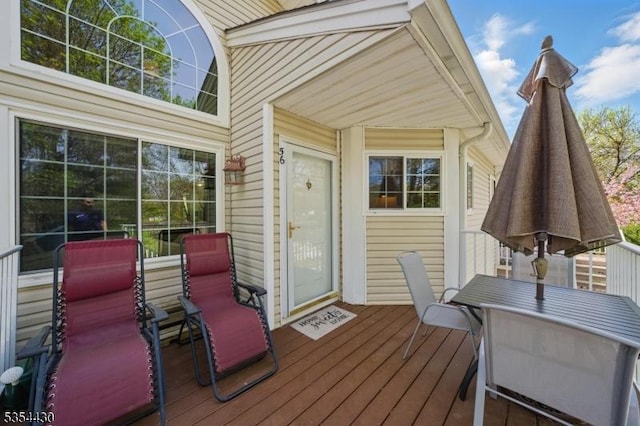 wooden deck with outdoor dining area