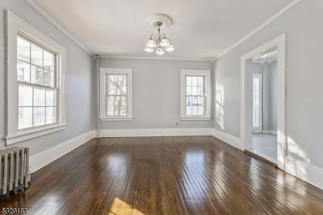 unfurnished dining area with crown molding, baseboards, wood-type flooring, a notable chandelier, and radiator heating unit