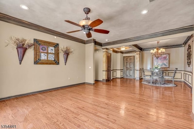 unfurnished living room featuring crown molding, wood finished floors, a ceiling fan, a chandelier, and recessed lighting