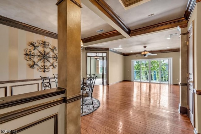 living area featuring ornamental molding, a ceiling fan, decorative columns, and light wood-style floors