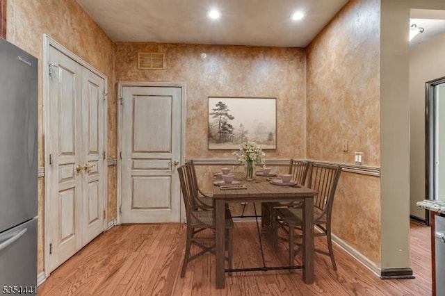 dining area featuring light wood-style floors and recessed lighting