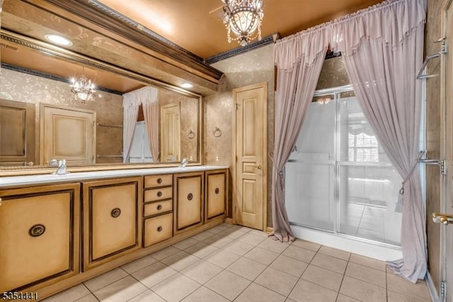 bathroom featuring a chandelier, wallpapered walls, tile patterned floors, and vanity