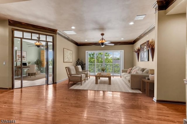 living room featuring ceiling fan, crown molding, hardwood / wood-style flooring, baseboards, and recessed lighting