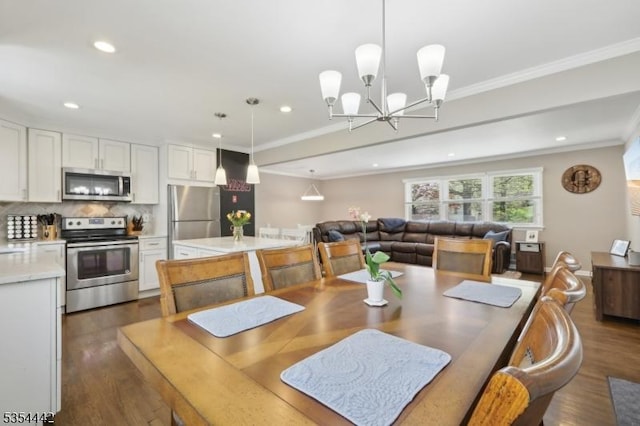 dining area with crown molding, recessed lighting, dark wood-style floors, and an inviting chandelier