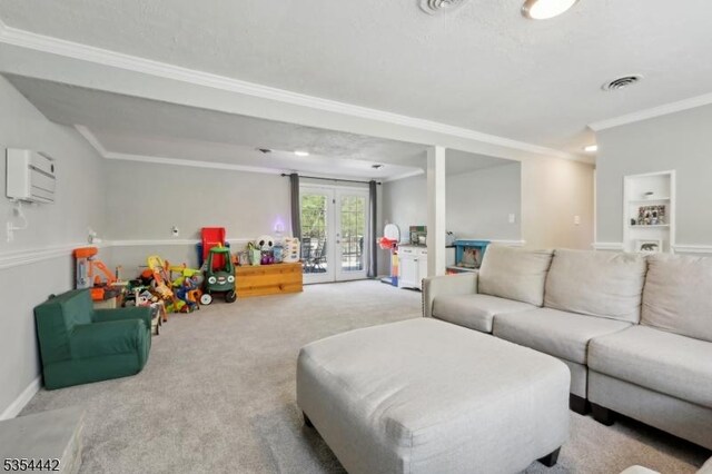 carpeted living area featuring visible vents, ornamental molding, and french doors