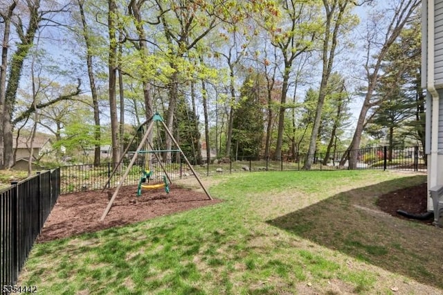 view of yard featuring a fenced backyard and a playground