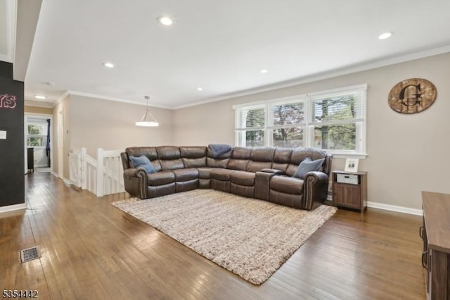 living room with visible vents, baseboards, ornamental molding, recessed lighting, and dark wood-type flooring
